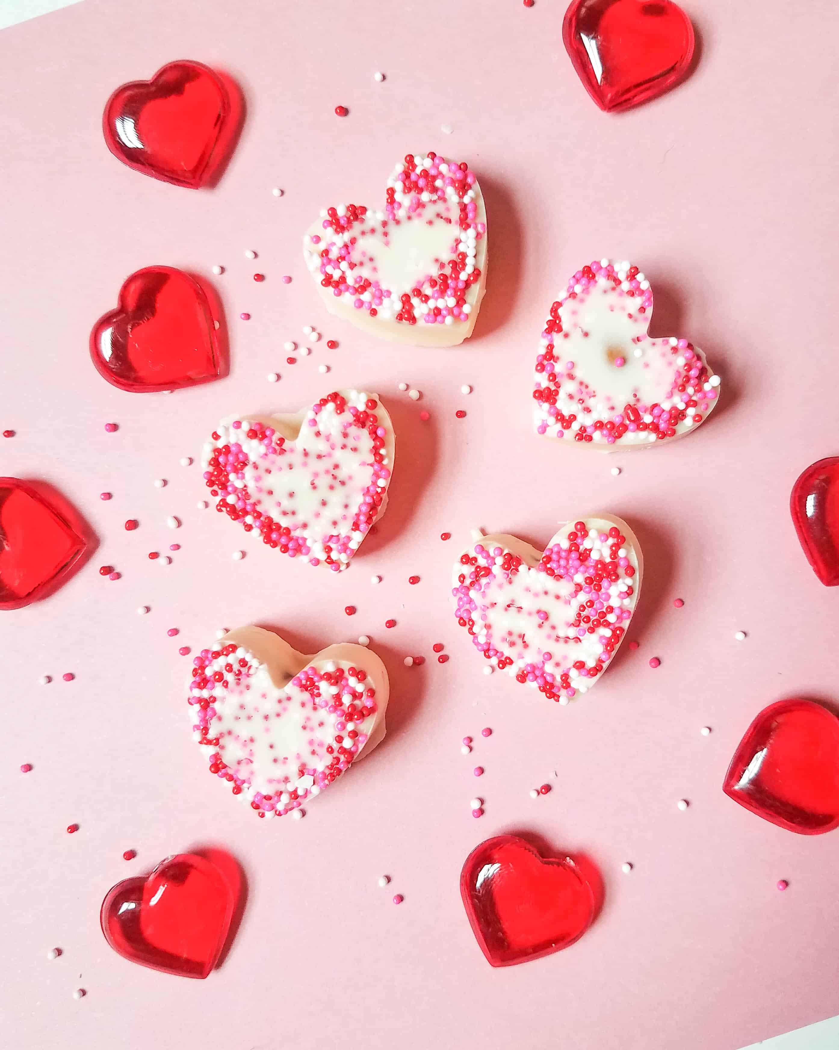 Looking for an easy treat to make for Valentine's day? Check out these adorable white chocolate almond hearts! #valentinesday #valentines #valentinesdayparty This Valentine's Day Treat is sure to please!