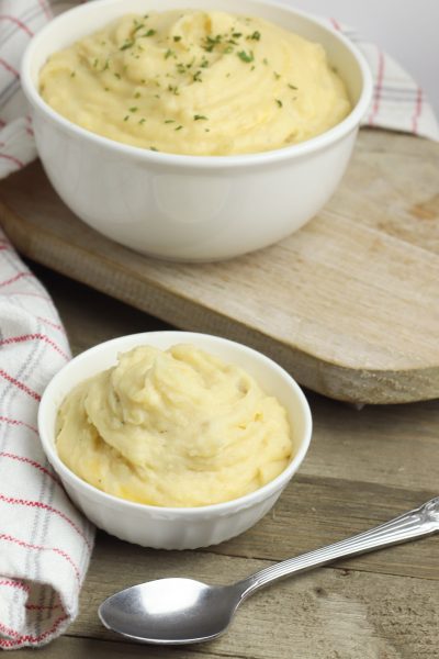 This crockpot mashed potatoes with cheddar recipe takes requires no boiling. It's perfectly delicious for thanksgiving or your next dinner party!
