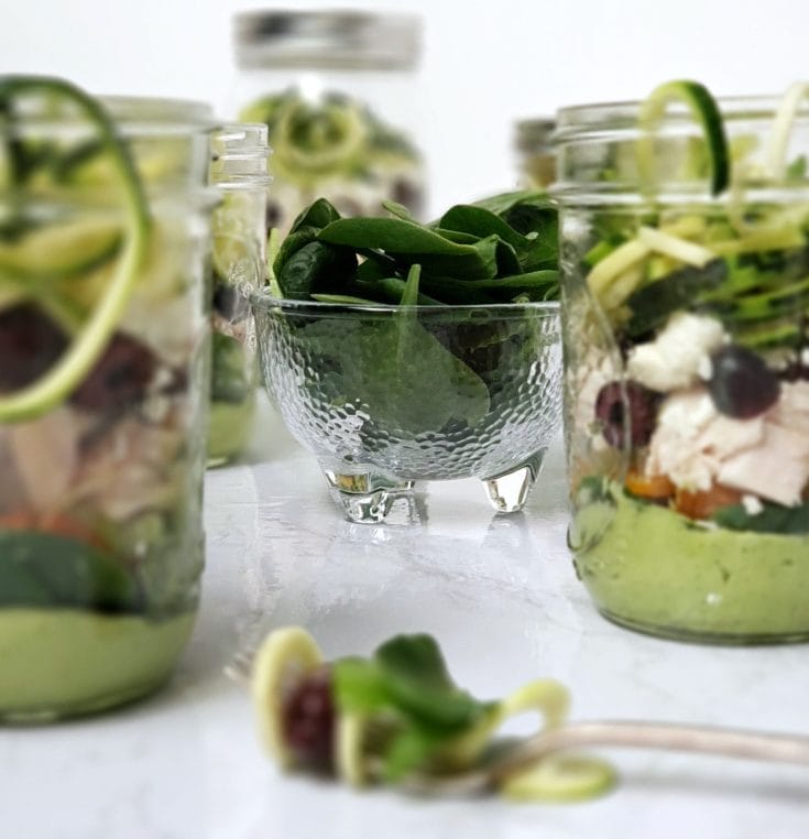 This Zucchini Noodle Salad with chicken recipe is fun to make and put in a mason jar for an easy healthy make ahead lunch for work. Clean eating made super easy with meal prepping. #mealprep #cleaneats