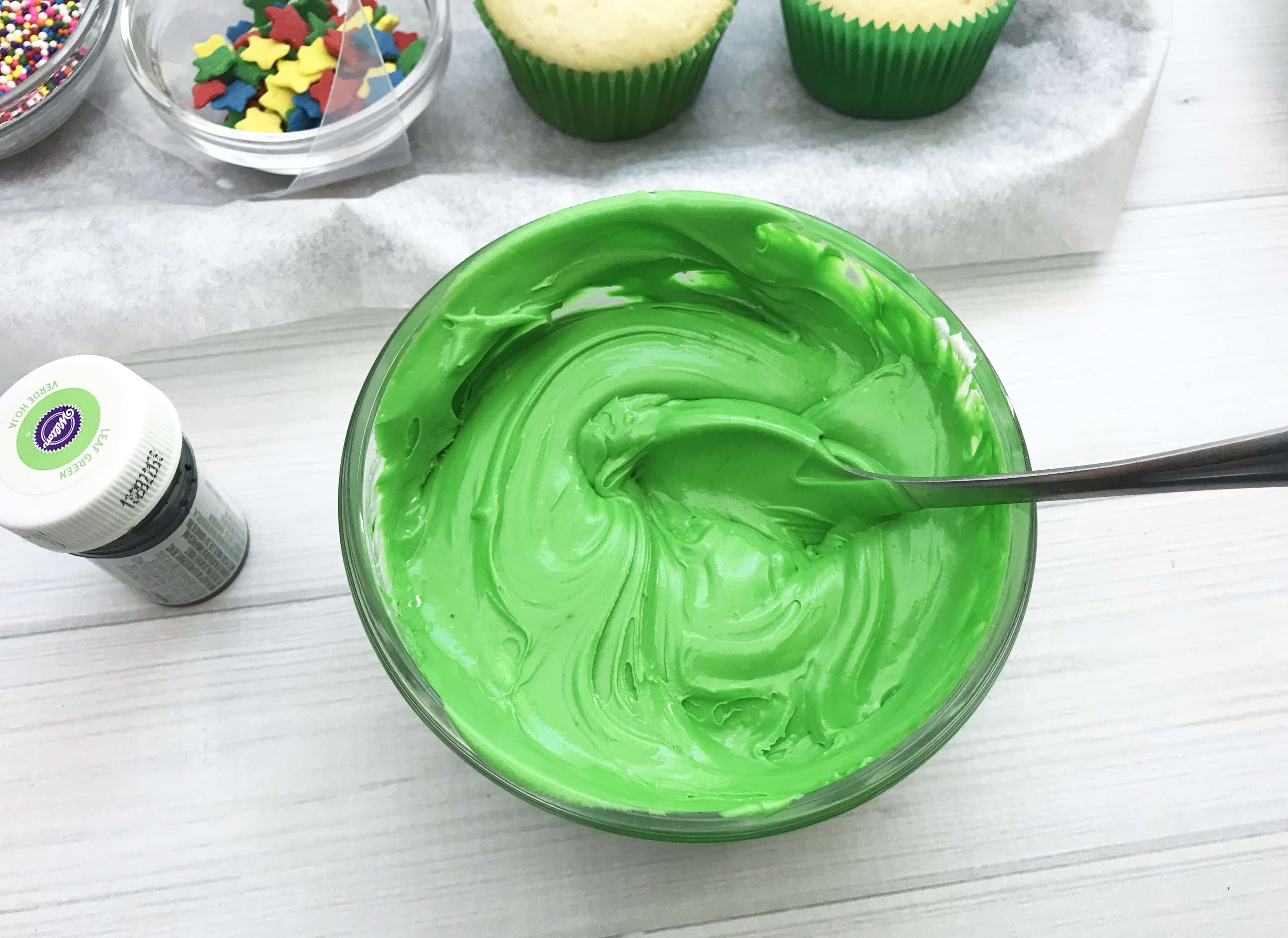 These Christmas Tree Cupcakes are so fun and festive! You can use store bought or your own homemade cupcake recipe for these delicious treats! They are perfect for holiday parties, bake sales and so much more. The pretty green color makes it super attractive to anyone!