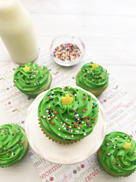 These Christmas Tree Cupcakes are so fun and festive! You can use store bought or your own homemade cupcake recipe for these delicious treats! They are perfect for holiday parties, bake sales and so much more. The pretty green color makes it super attractive to anyone!