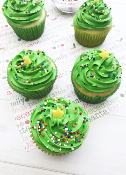 These Christmas Tree Cupcakes are so fun and festive! You can use store bought or your own homemade cupcake recipe for these delicious treats! They are perfect for holiday parties, bake sales and so much more. The pretty green color makes it super attractive to anyone!
