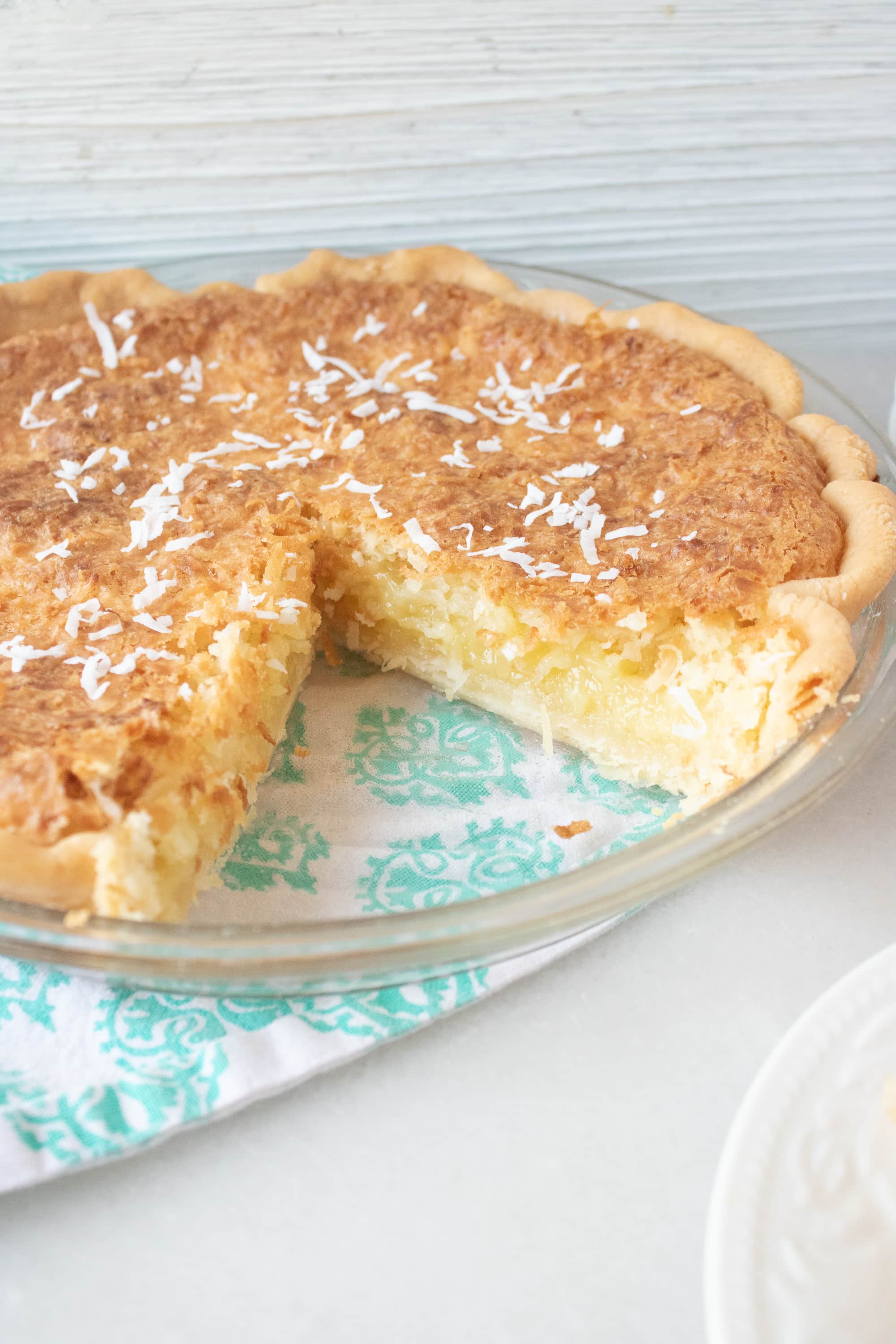 This coconut cream pie recipe features a yummy and creamy coconut filling, can be used with your favorite pie crust, and topped with coconut shavings. Perfect for Thanksgiving and anytime.