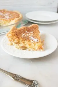 This coconut cream pie recipe features a yummy and creamy coconut filling, can be used with your favorite pie crust, and topped with coconut shavings. Perfect for Thanksgiving and anytime.