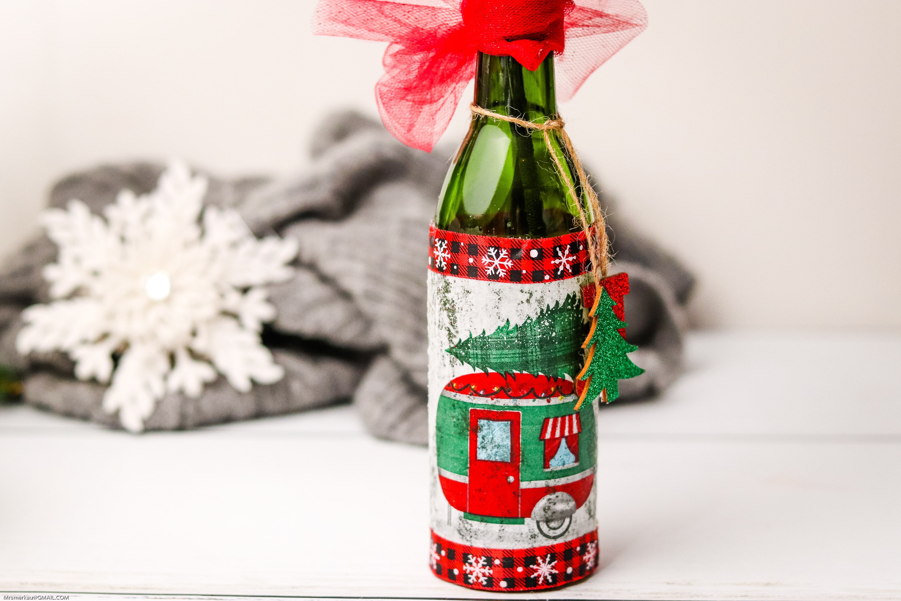 This Christmas Table DIY centerpiece is super easy to make and great to give as a hostess gift! This craft uses simple materials you likely have at home!