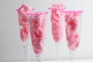 four glasses filled with cotton candy
