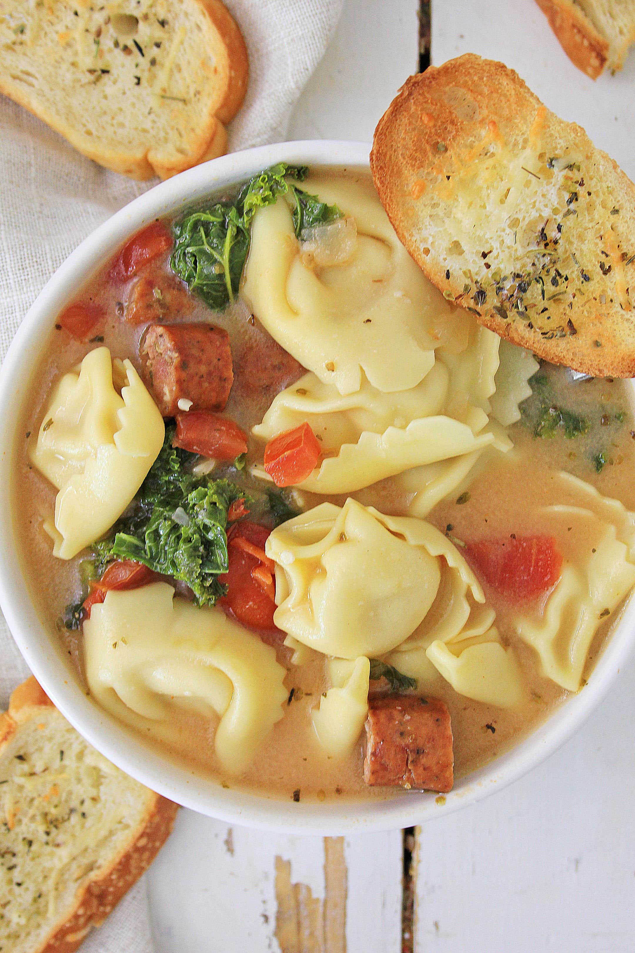 This is a wonderful hearty soup to make on a cool Fall day, or chilly Winter night. It's packed with spices and flavors that blend together for a delicious bowl of healthy goodness. Serve this with some crusty garlic bread, or bread sticks, and you have a great meal everyone will love. #soups #pastasoup #tortellinisoup