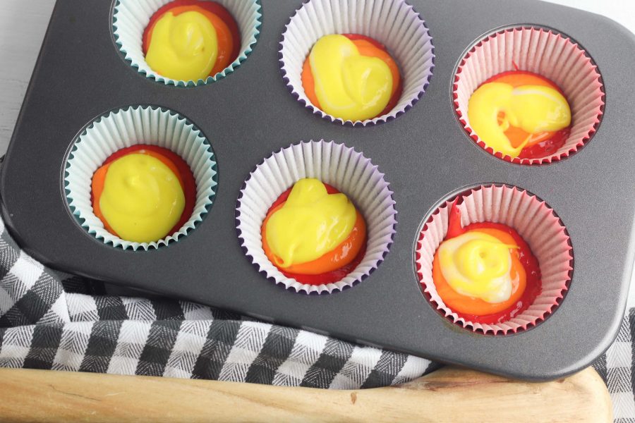 layering the cupcakes in the muffin tin