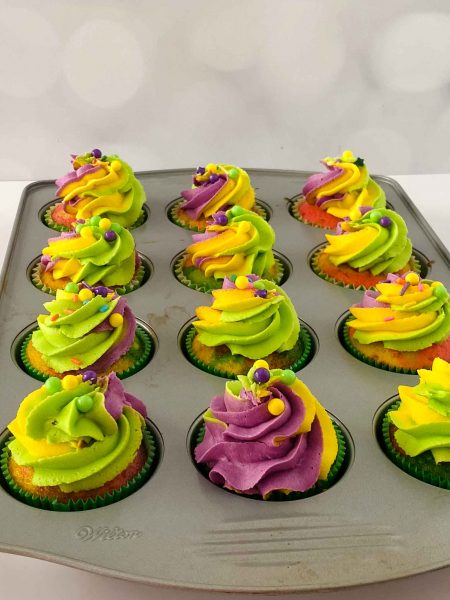 mardi gras cupcakes in muffin tin