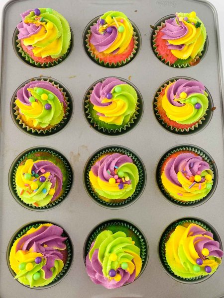 mardi gras cupcakes in muffin tin